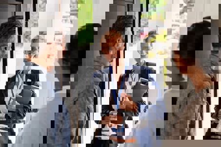 woman greeting couple