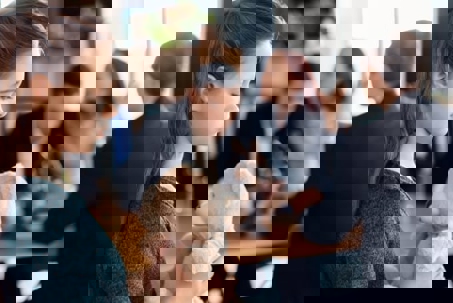 girl holding teddy bear